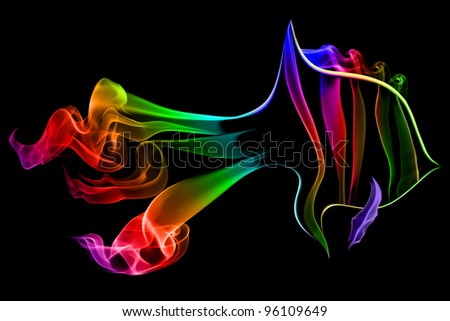 color abstract fish from smoke on the black background