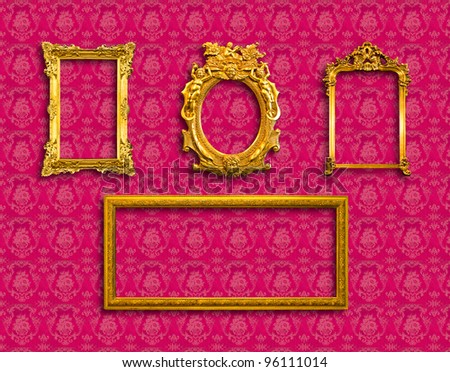 frame of golden wood  on red wallpaper