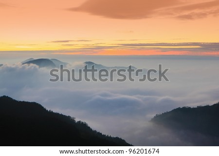 dramatic Clouds rolling over mountains at sunset shot in taiwan formosa asia