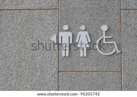 Sign of public toilets WC on cement background