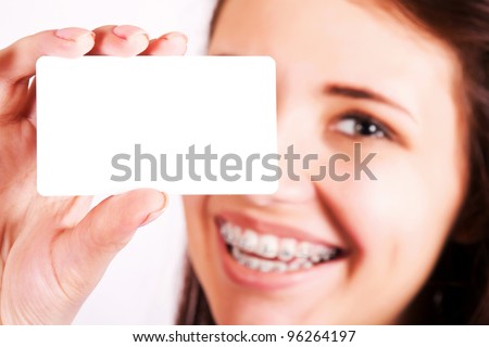 Girl with braces presenting business card