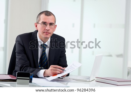 Lawyer or notary public on his workplace signing contract