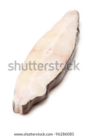 Halibut fish steak isolated on a white studio background.