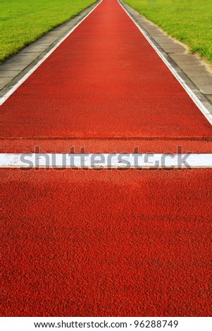 Long jump track in a sports and athletics stadium Royalty-Free Stock Photo #96288749