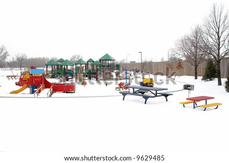                A picture of a beautiful playground in the winter snow
