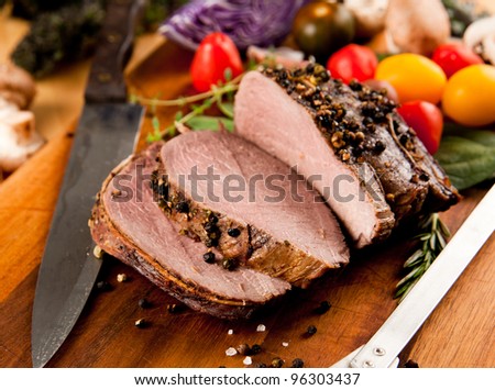 Sliced Beef Roast with Crashed Peppercorns and Vegetables Royalty-Free Stock Photo #96303437