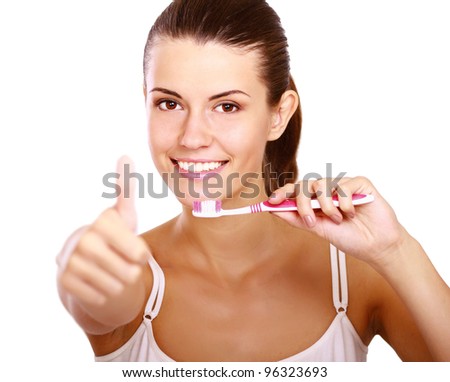 Smiling woman with great teeth holding tooth-brush, isolated on white background