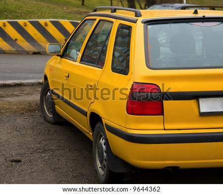 Yellow car near the road with Yellow and Black Attack