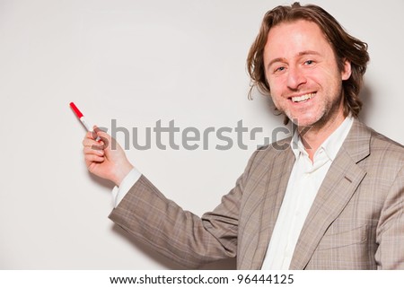 Business man long hair standing in front of whiteboard