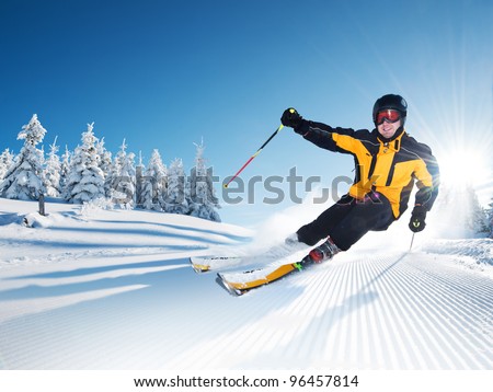 Skier in mountains, prepared piste and sunny day Royalty-Free Stock Photo #96457814