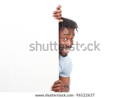 Cheerful young african american man with blank signboard, isolated on white background