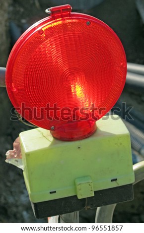red light to signal a road construction site at night