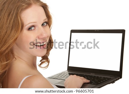 Beautiful happy girl with flowing hair holding a laptop with blank screen isolated on a white background