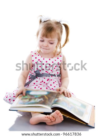 baby girl reading a book. isolated on white background
