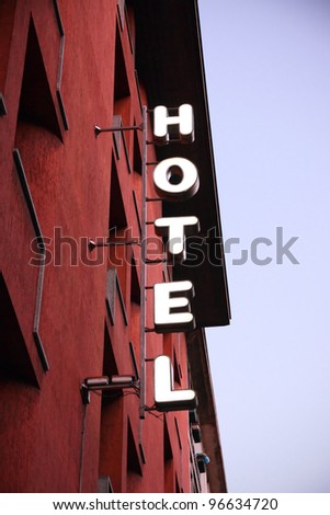 Light hotel sign at duskin in city