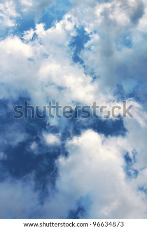 This vertical photo of a dramatic cumulus cloud filled blue sky would make a perfect background or stationary.  It would also work well to replace a less dramatic sky in an otherwise  good photograph.