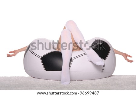 Football and soccer supporter on an inflatable chair on white background