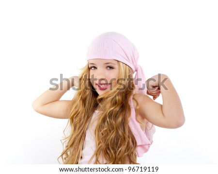 kid girl with pirate handkerchief showing her biceps muscle