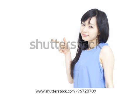 Cute woman pointing copy space, isolated on white background.