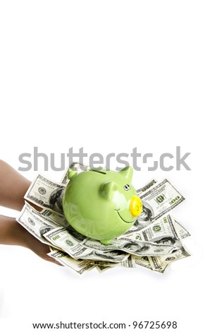 a woman holding a lot of money and piggy bank