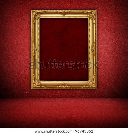 golden frame on red wall
