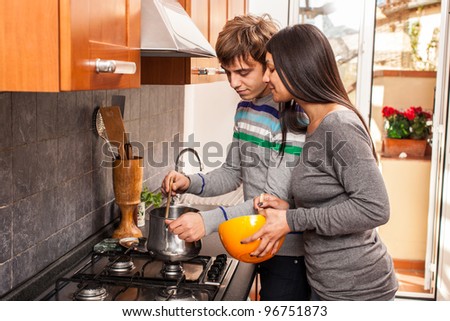 Happy Multiracial Couple in the Kitchen