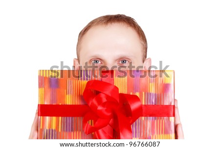 Closeup image of man's head with big red gift box