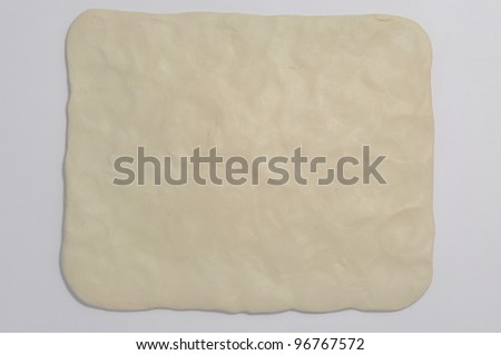 Simple plasticine white background. It is a plasticine plane rectangle with rounded corners and with fingerprints texture.