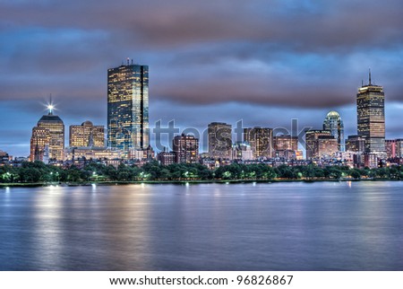 Evening view of the Boston Skyline with brightly illuminated buildings in HDR