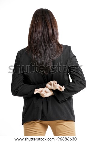 businesswoman with crossed fingers