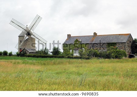 Brittany (Northern France) - Windmill and old house in the countryside near Mont-St-Michel