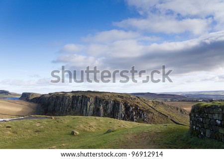 Hadrians Wall on Steel Rigg / Hadrians Wall built on the Whin Sill at Steel Rigg Royalty-Free Stock Photo #96912914