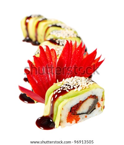 Sushi Roll with avocado, eel, tobiko caviar, sauce and sesame seeds. "Green Dragon"