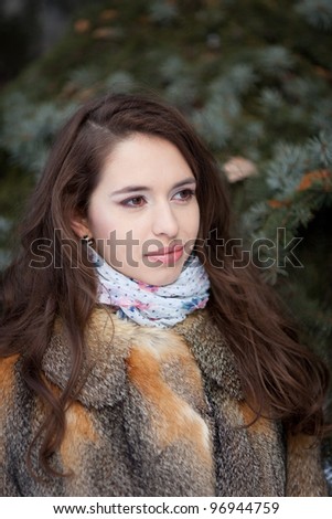 A girl in a fur coat