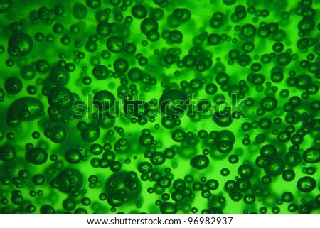 natural green water background with oxygen bubbles
