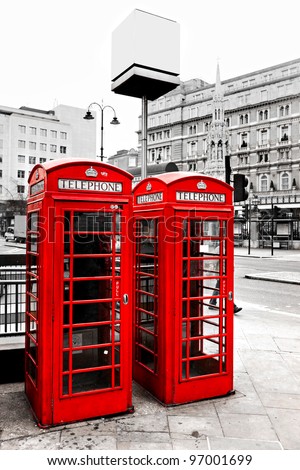 Red telephone boxes with black and white background, London, UK.