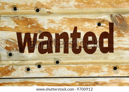 Bullet holes and Wanted sign into wood background Royalty-Free Stock Photo #9700912