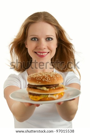 attractive girl holds out a plate of fast food, hamburger isolated on white background