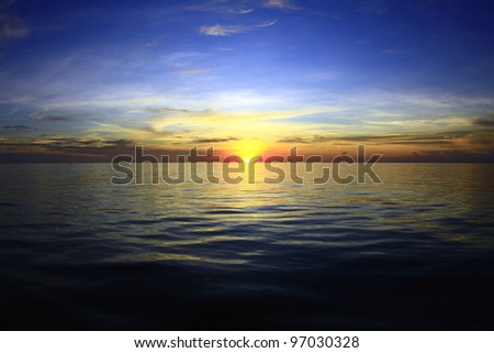 Sunset over the sea Royalty-Free Stock Photo #97030328