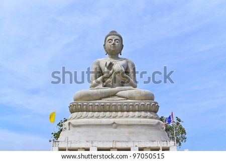 Buddha statue against blue sky background in thai temple