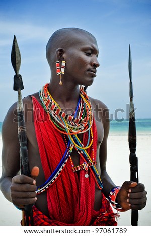 Maasai by the ocean on the beach Royalty-Free Stock Photo #97061789