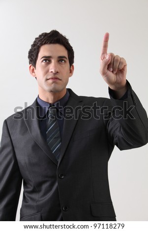 Businessman touching on a virtual whiteboard