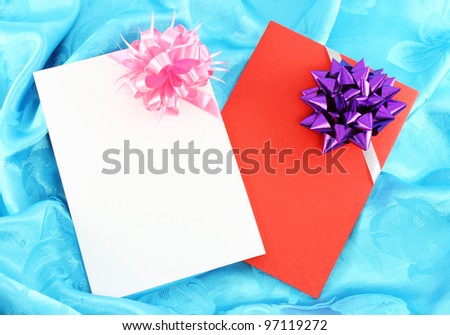 gift card with ribbon on blue satin
