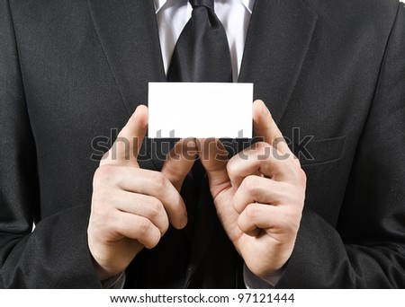 a man holds, a business card isolated on a white background