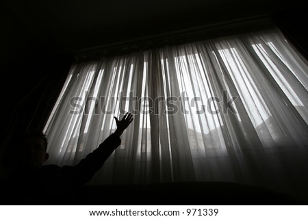 man shot against the light of a window  (slow shutter speed, the man been on the picture for only part of the exposure and therefore a bit transparent)