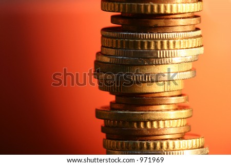money coins in a pile with red background