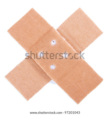 Closeup of two sticking plasters over a white background
