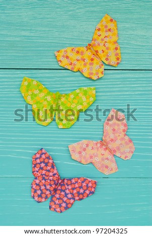 Butterfly origami on blue wall