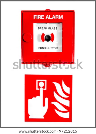 Fire alarm button encased in glass over a sign showing a finger pushing the button near flames on a white wall
