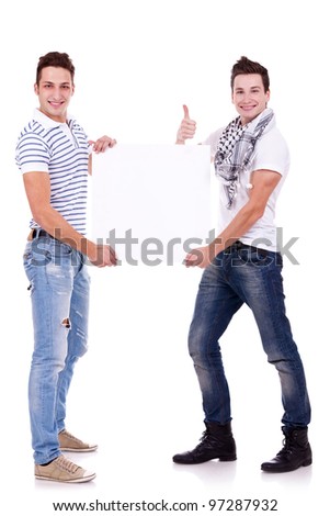 two young men holding a blank board on white background